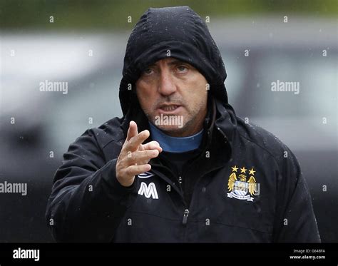 Manchester City Manager Roberto Mancini Arrives For A Press Conference