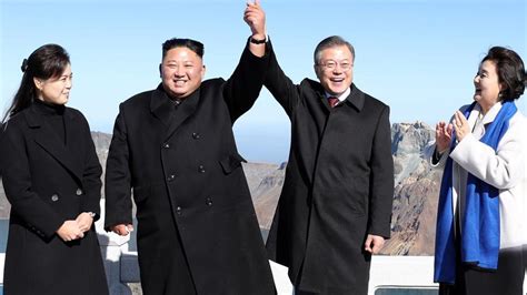 Kim Jong Un Joins Hands With South Koreas Moon On Peak Of Sacred North