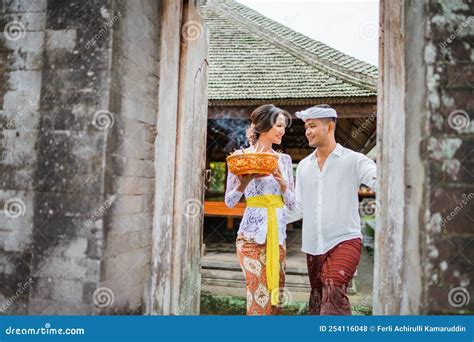 Balinese Couple Wearing Kebaya Dress And Traditional Balinese Costume