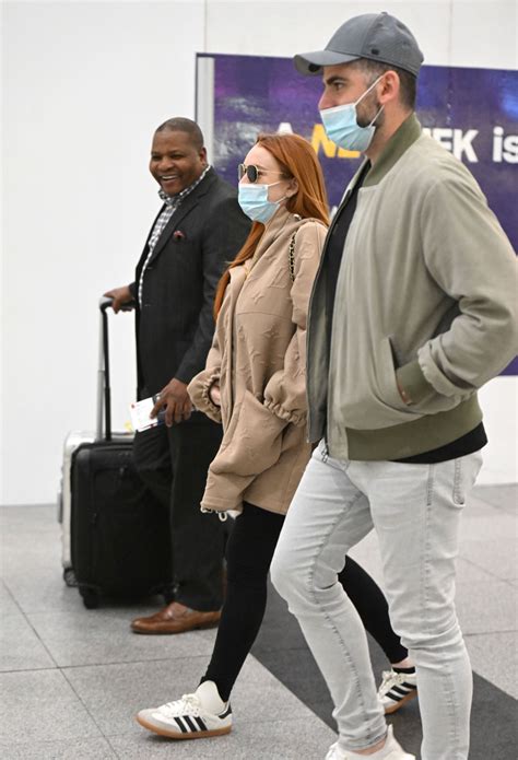 Lindsay Lohan And Husband Bader Shammas At Jfk Airport In New York 04