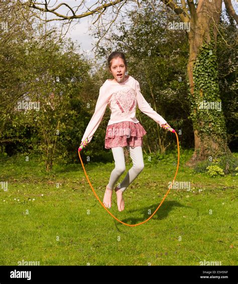 Young Girl Using Skipping Rope Stock Photo Alamy