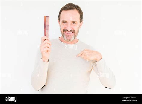 Portrait Mature Man Combing Hair Hi Res Stock Photography And Images