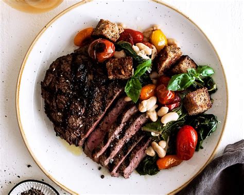 Peppercorn Crusted Rib Eyes With Burst Tomato Panzanella The Original