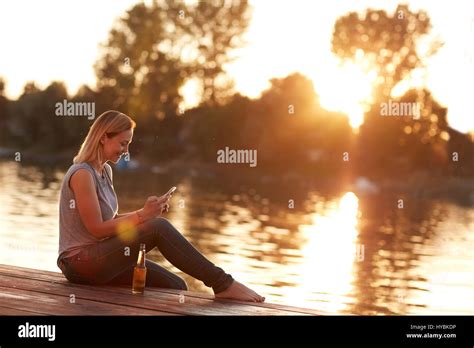 Girl Sitting Alone In Sunset