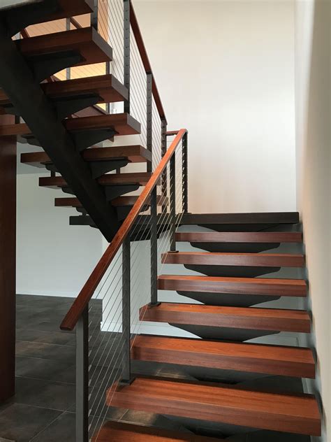 Floating Stairs With Cable Railing And Wood Treads In Floating