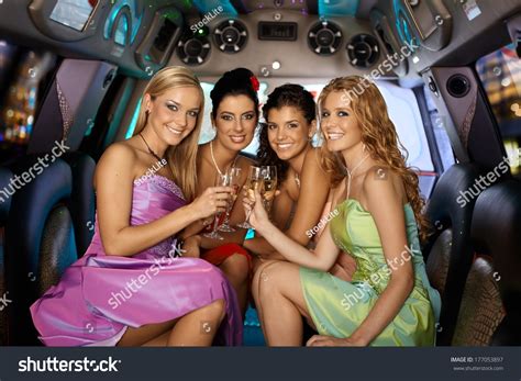 Group Of Beautiful Elegant Smiling Girls Celebrating In Limousine