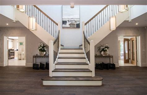 Marble Double Staircase Entrance : Leaded glass windows complement a ...