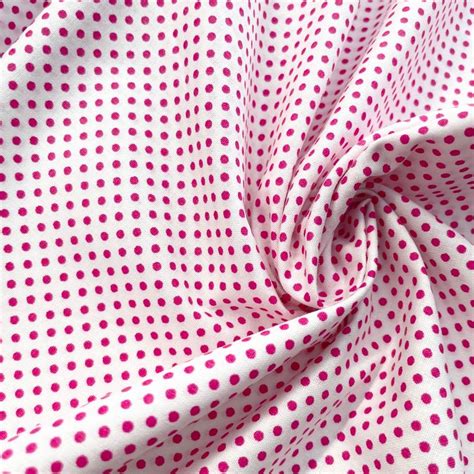 A Pink And White Polka Dot Print Fabric