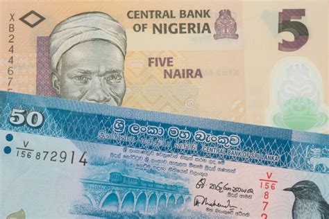 A Orange Plastic Five Naira Note From Nigeria Paired With A Blue And