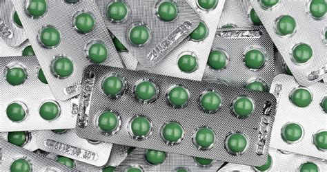 Premium Photo Full Frame Green Round Pills In Blister Pack