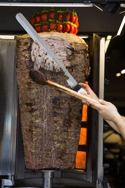 An Arm Moving To Cut The Kebab Meat Stock Image Image Of Kebab Slice