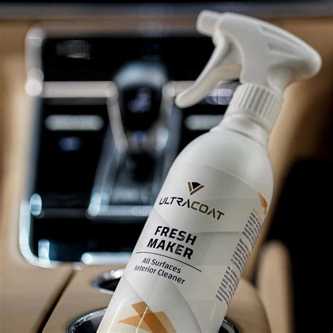 A Bottle Of Fresh Cleaner Sitting On Top Of A Car Dashboard Next To A