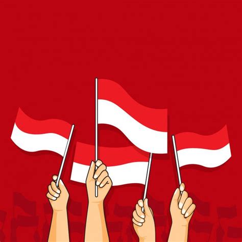 Two Hands Holding Flags With The Flag Of Denmark In Front Of Them On A