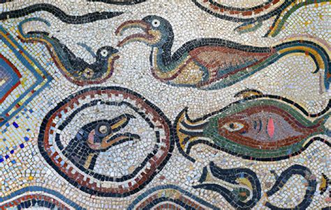 An Artistic Mosaic With Birds And Fish On It