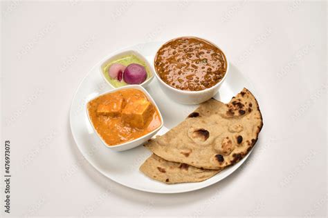 Paneer Butter Masala And Daal Makhani Served With Tandoori Roti In