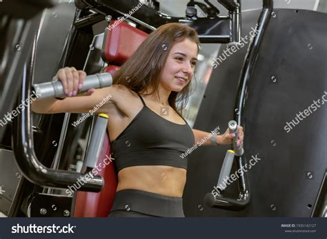 Young Fit Woman Trains Pectoral Muscles Stock Photo 1935142127 ...