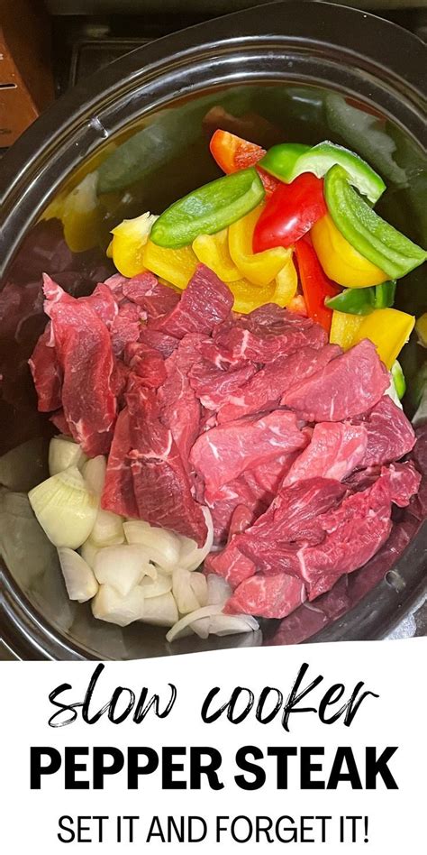 Slow Cooker Pepper Steak Served In A Pot With Onions Peppers And Celery