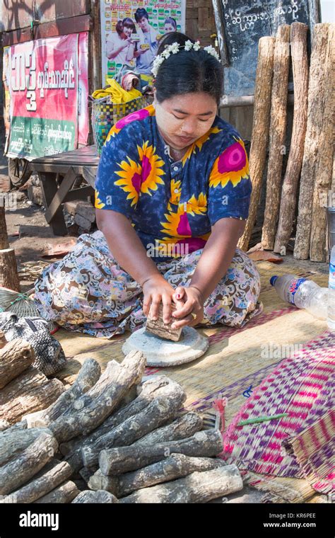 Pyay market, Burma, February 2012: Burmese woman selling thanaka barks ...