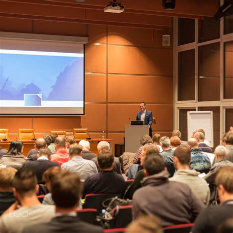 Speaker giving a talk in conference hall at business event. Audience at ...