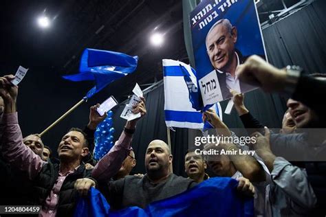 Likud Party supporters celebrate with a photo of Prime Minister... News ...