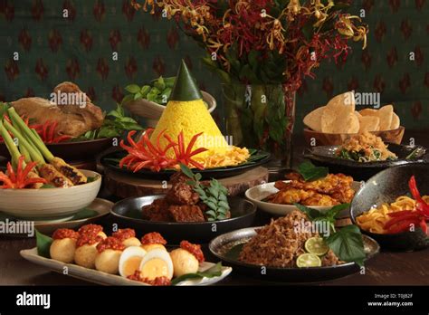 Nasi Tumpeng Nusantara. Festive and grand Indonesian Rijsttafel of ...