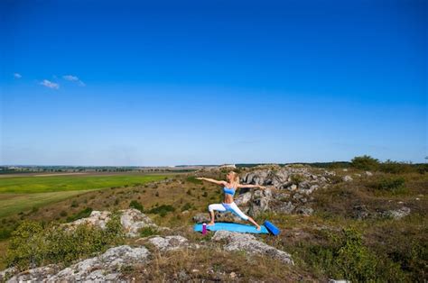 Premium Photo Young Beautiful Blonde Woman Doing Yoga Exercises On A