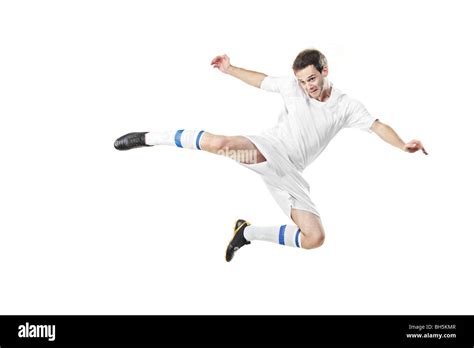 Soccer Player Jumping Isolated On White Background Stock Photo Alamy