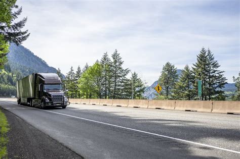 Dark Brown Bonnet Big Rig Semi Truck With Grille Guard Transporting