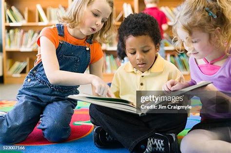 2,981 Children Sharing Books Stock Photos, High-Res Pictures, and ...