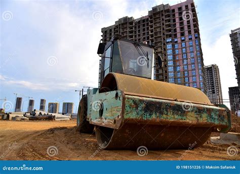 Vibro Roller Soil Compactor Leveling Ground At Construction Site Tower