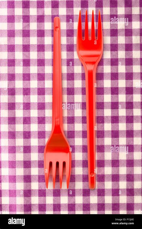 Red Plastic Forks Vertical In Close Up Stock Photo Alamy