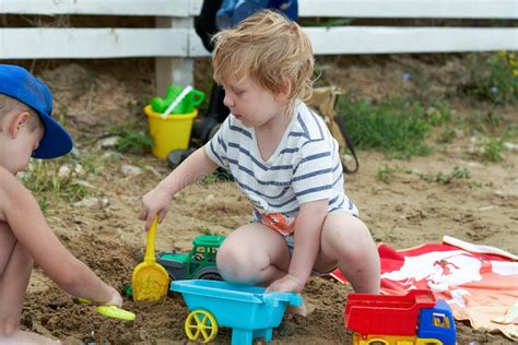 Two Children Play in the Sand with Plastic Toys Stock Image - Image of play, active: 237699553