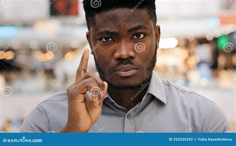 Close Up Young Serious Angry African American Man Sternly Looking At