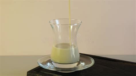 Traditional Thick Oriental Tea With Milk And Spices Is Poured Into