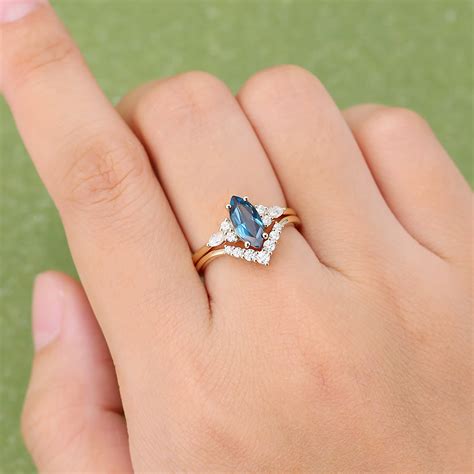 Gardensring Marquise Cut London Blue Topaz Yellow Gold Moissanite Engagement Ring Set Gardensring