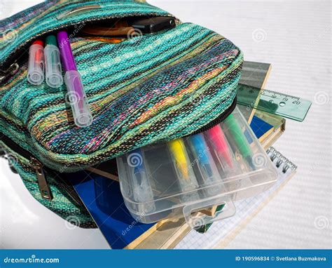 School Bag With Textbooks Notebooks And Other Educational Accessories