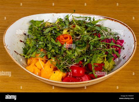 Vegan Salad with mango and avocado Stock Photo - Alamy