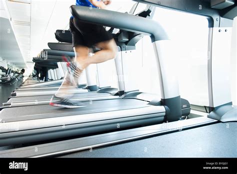 Man Running On Treadmill In Gym Stock Photo Alamy