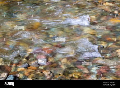 Naturally Colorful River Rocks Under Water In Glacier National Park