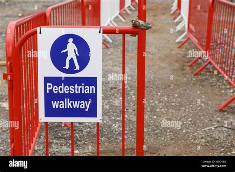 Pedestrian walkway sign and barriers on a UK construction site Stock ...