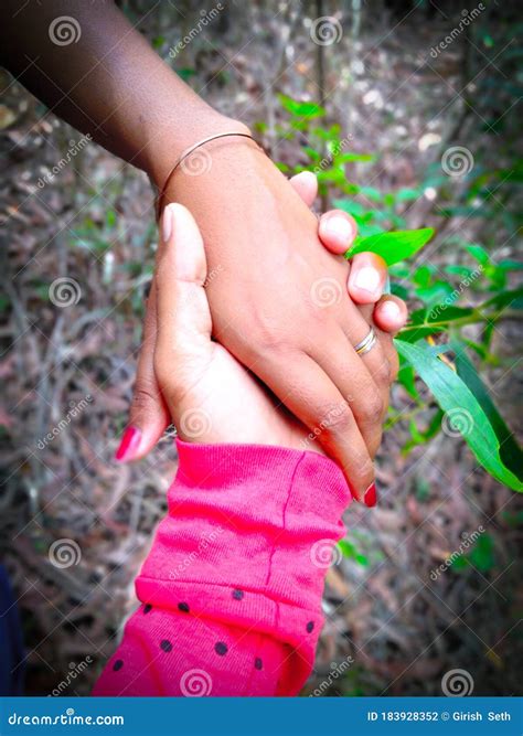 A Boy Holding a Girl`s Hand Stock Photo - Image of design, mode: 183928352