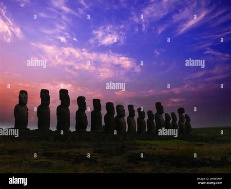 Moai Statues In Easter Island Illuminated By A Dramatic Sunset Stock