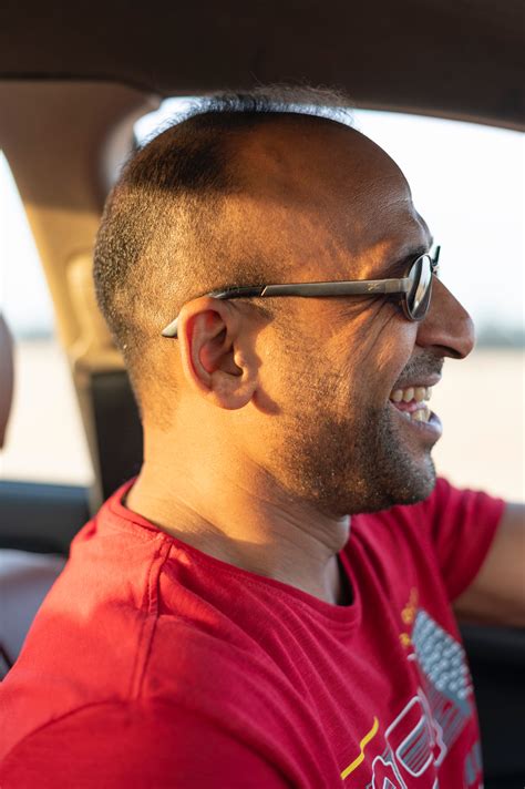 Close-Up Photo of a Police Officer Wearing Sunglasses · Free Stock Photo