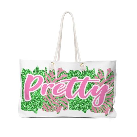 A White And Pink Bag With The Word Pretty Printed In Pink Letters On It