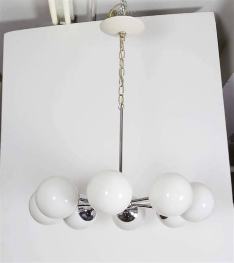 Pair of Lightolier Glass Globe Chandeliers in Chrome For Sale at 1stDibs