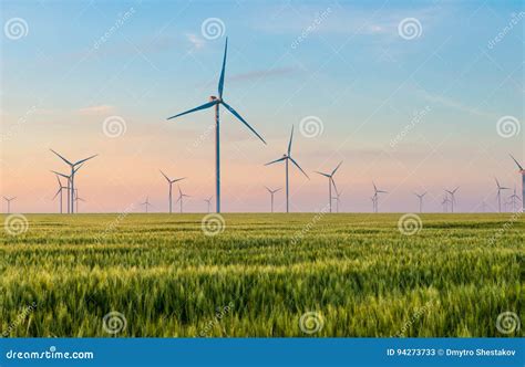 Group Of Windmills For Electric Power Production In The Green Field Of