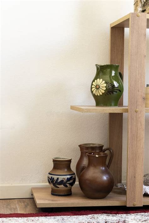 Different Ceramic Pottery Vases On Shelves Interior Design Stock Image