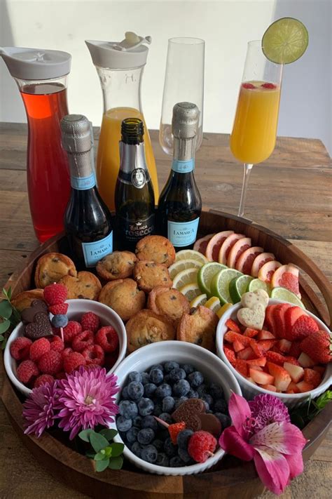 Mimosa Brunch Board - Assorted citrus, fruits, and juice to craft your own DIY mimosa. Paired ...