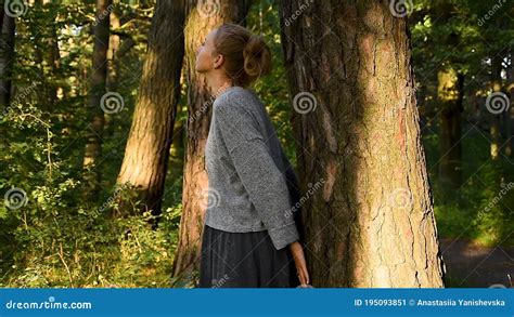 Environmentalist Is Hugging Tree In Forest And Loving Nature Hands Of