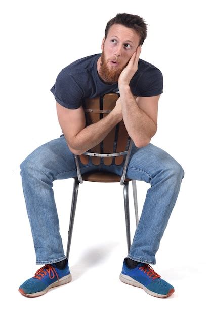 Premium Photo Man Sittin On A Chair With Expression Of Forgetfulness